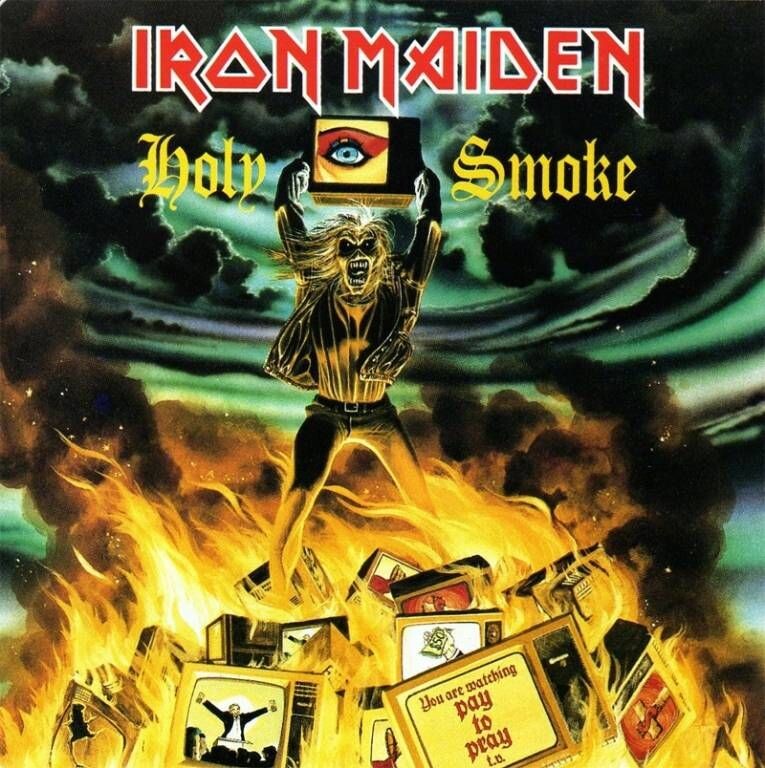 Eddie quemando televisores en la portada del single Holy Smoke (1990) de Iron Maiden.